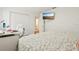 Bedroom features hardwood floors, a desk and a closet with white doors at 5248 Royal Point Ave, Kissimmee, FL 34746