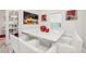 Bright dining area with a modern white table and seating, illuminated by stylish lighting at 5248 Royal Point Ave, Kissimmee, FL 34746