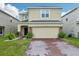 Charming two-story home with brick paver driveway and manicured landscaping at 5248 Royal Point Ave, Kissimmee, FL 34746
