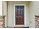 Close up of front door framed by stone accents and brick pavers at 5248 Royal Point Ave, Kissimmee, FL 34746