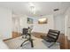 Living area featuring hardwood floors, sleek modern seating arrangements, and tasteful wall decorations with neutral decor at 5248 Royal Point Ave, Kissimmee, FL 34746
