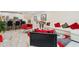Bright, open living room with white walls, modern furnishings, and sleek marble flooring at 5248 Royal Point Ave, Kissimmee, FL 34746