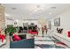 Open-concept living room with modern lighting, sleek floors, and a seamless flow to the kitchen at 5248 Royal Point Ave, Kissimmee, FL 34746
