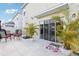 Spacious backyard patio with outdoor seating and tropical plants at 5248 Royal Point Ave, Kissimmee, FL 34746