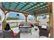 Charming pergola with comfortable seating, overlooking a serene lake view at 5248 Royal Point Ave, Kissimmee, FL 34746