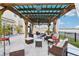 Relaxing outdoor pergola with stylish seating and decorative lighting at 5248 Royal Point Ave, Kissimmee, FL 34746