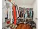 Large walk-in closet is well-stocked and organized for easy access and convenient storage at 5248 Royal Point Ave, Kissimmee, FL 34746