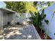Backyard showcases stone floors and lush plants, creating a peaceful outdoor retreat at 567 E Orange St # 567, Altamonte Springs, FL 32701