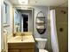 Bathroom features a shower with unique wall tile, shelving, and updated fixtures at 567 E Orange St # 567, Altamonte Springs, FL 32701