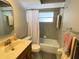 Cozy bathroom features a bathtub with shower, gold fixtures, and mosaic tile at 567 E Orange St # 567, Altamonte Springs, FL 32701