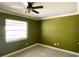 Bedroom with ceiling fan, window, and wood-look floors at 567 E Orange St # 567, Altamonte Springs, FL 32701