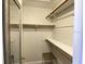 Walk-in closet featuring shelves and hanging rods, ready for organized storage solutions at 567 E Orange St # 567, Altamonte Springs, FL 32701