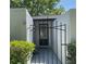 Gated entryway with black iron fencing and decorative plants offering security and privacy to the home's entrance at 567 E Orange St # 567, Altamonte Springs, FL 32701