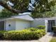 Charming single-story home with neutral stucco, mature landscaping, and inviting curb appeal beneath a mature shade tree at 567 E Orange St # 567, Altamonte Springs, FL 32701