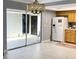 Open layout with kitchen and dining featuring a large sliding glass door bringing the outside in and flooding the space with light at 567 E Orange St # 567, Altamonte Springs, FL 32701