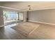 Bright living room featuring sliding glass doors to an outdoor patio and neutral decor creating an open, airy space at 567 E Orange St # 567, Altamonte Springs, FL 32701