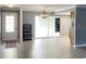 Bright and spacious living room with a sliding glass door with access to a patio, offering natural light and an airy ambiance at 567 E Orange St # 567, Altamonte Springs, FL 32701