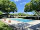 Outdoor swimming pool surrounded by lush greenery and trees, creating a refreshing oasis at 567 E Orange St # 567, Altamonte Springs, FL 32701