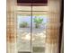 Outdoor view from bedroom sliding glass doors with privacy wall, plants, and pavers at 567 E Orange St # 567, Altamonte Springs, FL 32701