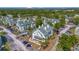 This aerial view shows the buildings in a landscaped setting with parking at 6142 Westgate Dr # 204, Orlando, FL 32835