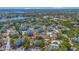 Aerial view of the community showing multiple buildings, lake, tennis courts and pools at 6142 Westgate Dr # 204, Orlando, FL 32835