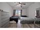 Bedroom with two beds, neutral decor, and ample natural light at 6142 Westgate Dr # 204, Orlando, FL 32835