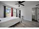Bedroom with a ceiling fan, window, and views of the neighborhood and a ensuite bathroom at 6142 Westgate Dr # 204, Orlando, FL 32835