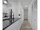 Kitchen featuring granite countertops, stainless steel appliances, and a stylish black and gold faucet at 6142 Westgate Dr # 204, Orlando, FL 32835