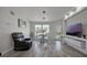 Bright, modern living room with stylish furniture, recessed lighting and ample natural light at 6142 Westgate Dr # 204, Orlando, FL 32835