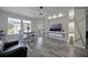 Sunlit living room with modern lighting, neutral walls, and comfortable seating area at 6142 Westgate Dr # 204, Orlando, FL 32835