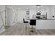 Open concept kitchen flows into a well-lit area with sleek floors and artistic design details at 6142 Westgate Dr # 204, Orlando, FL 32835