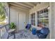 This charming patio features tile floors, seating and views of the building and grounds at 6142 Westgate Dr # 204, Orlando, FL 32835