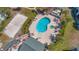 This aerial view features the community pool, whirlpool and volleyball court at 6142 Westgate Dr # 204, Orlando, FL 32835