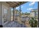 This screened porch features tiled floors, seating and views of the building and grounds at 6142 Westgate Dr # 204, Orlando, FL 32835