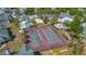 Aerial view of the community showing the tennis courts and pool area at 6142 Westgate Dr # 204, Orlando, FL 32835