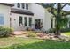 Backyard patio with seating area and landscaping, offering a peaceful outdoor space at 645 Manor Rd, Maitland, FL 32751