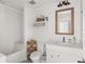 Bright bathroom featuring a tiled tub and updated vanity at 645 Manor Rd, Maitland, FL 32751