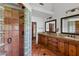 Luxurious bathroom with a tiled walk-in shower and a double sink vanity at 645 Manor Rd, Maitland, FL 32751
