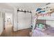 bedroom featuring bunk beds, and sliding barn doors at 645 Manor Rd, Maitland, FL 32751
