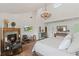 Spacious primary bedroom has fireplace, ensuite bath, high ceilings and natural light at 645 Manor Rd, Maitland, FL 32751