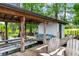 Covered dock with a boat lift and paddleboards offers easy access to the peaceful lake at 645 Manor Rd, Maitland, FL 32751