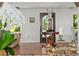 Stylish entryway with hardwood floors, front door with a patterned glass insert, and elegant decor at 645 Manor Rd, Maitland, FL 32751