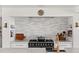 Contemporary kitchen with marble counters, subway tile backsplash and copper fixtures at 645 Manor Rd, Maitland, FL 32751