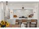Bright and airy kitchen featuring subway tile backsplash, modern appliances, and stylish bar seating at 645 Manor Rd, Maitland, FL 32751