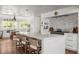 Gourmet kitchen with marble countertops, breakfast bar seating, and stainless steel appliances at 645 Manor Rd, Maitland, FL 32751