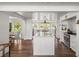 Open concept kitchen with marble countertops, dining area, and connecting living space at 645 Manor Rd, Maitland, FL 32751