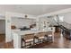 Open kitchen with a large island, seating, and modern finishes at 645 Manor Rd, Maitland, FL 32751