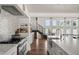 Spacious kitchen with marble countertops, stainless steel appliances, and hardwood floors at 645 Manor Rd, Maitland, FL 32751