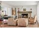 Cozy living room with fireplace, hardwood floors, and comfortable seating at 645 Manor Rd, Maitland, FL 32751