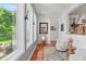 Sitting area with natural light from large windows with views, plus two chairs and Saltillo tile at 645 Manor Rd, Maitland, FL 32751